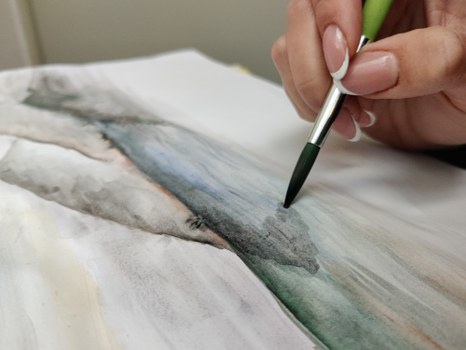 Pinsel mit Aquarell
