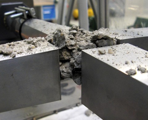 Destroyed concrete specimen after a trial in the biaxial Split-Hopkinson bar