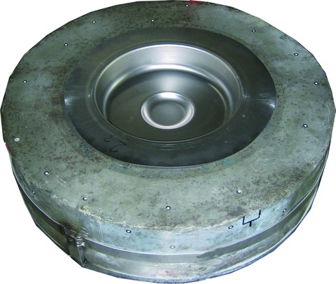 Concrete die with a bowl geometry with by-form element and formed sheet metal.