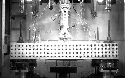Bottom side of a strengthened reinforced concrete plate after the experiment 