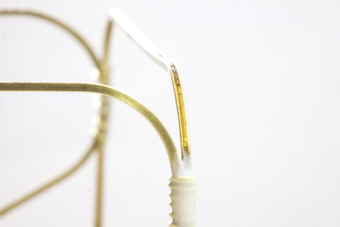 Fibre optic sensors embedded in a support frame made of brass U-profiles