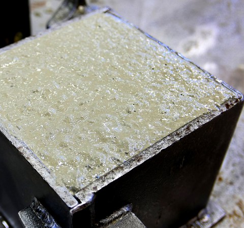 Fresh air-entrained concrete in a cube formwork
