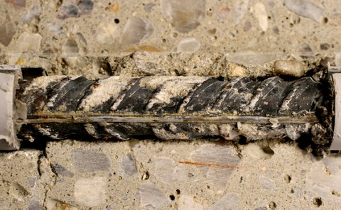 Bond zone with fiber-optic sensor after failure