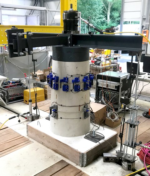 Preliminary tests on a tower structure consisting of three stacked reinforced concrete circular ring segments