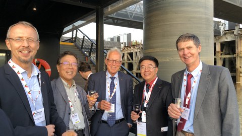 Welcome-Reception der Französischen Gruppe der IABSE auf der Nantilus (Nantes, Loire) am 18. September 2018 – Gratulation zur Wahl des Präsidenten der IABSE an Prof. Yaojun Ge (v. l. n. r.: Prof. Richard Stroetmann, Technische Universität Dresden; Prof. Y