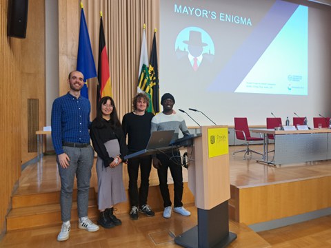 The four students at the lectern