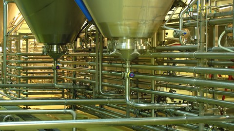 Factory Floor with Tanks and Pipes made of Stainless Steel