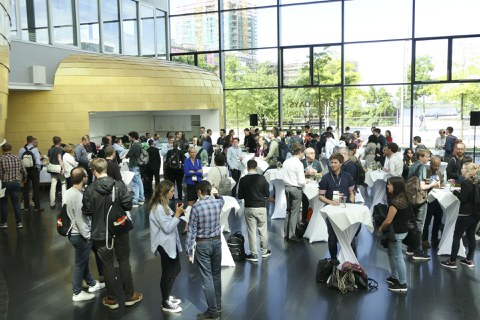 Foyer with people at bar tables