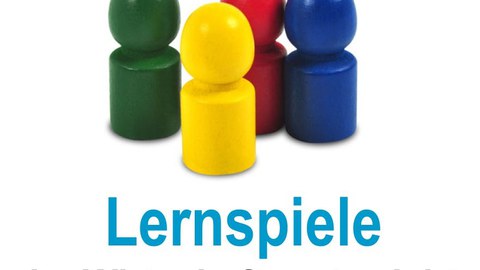 bunte Spielsteine unter denen "Lernspiele im Wirtschaftsunterricht" geschrieben steht