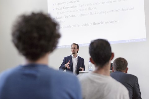 You see a man holding a speech