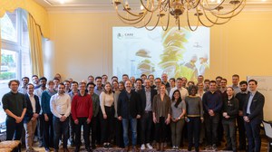 A group photo of the CARE team in a conference room 