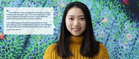A portrait photo with text. A smiling person on a black background with clustered specks in pink, purple, and green. On the right side of the photo, there is a white rectangle with a big quotation mark and text: ”The professors and colleagues in the lab are always friendly and willing to help. The internationality of the course allowed me to get to know a lot of different cultures and people from various countries. I am really happy to have the opportunity to study here. Being a part of RegBioMed program will definitely be one of the most unforgettable memories in my life. Juohan, Taiwan, 2017-19.” 