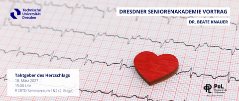A photo of an ECG trace. A red heart is lying on the paper.