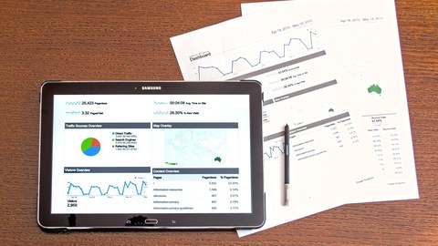 Tablet and sheets with charts