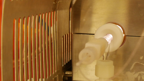 The connection of the Nebulizer to the Spray chamber is visible. They are covered with a metal neating shield. 