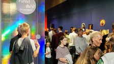 Entrance to the “Can You Feel It?” exhibition, with numerous guests.