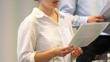 Sprecher:innen während des Symposium