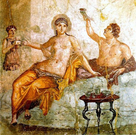 Wall painting depicting a banquet. A man drinks from a type of drinking vessel with two openings called a rhyton. His female companion wears a sheer garment and a golden net over her hair. A female servant attends to the couple, proffering a small box. The table in front holds a set of silver vessels for mixing wine. The whole scene represents an idealized Greek drinking party, a pleasurable sight for the guests of this first century Roman household. 