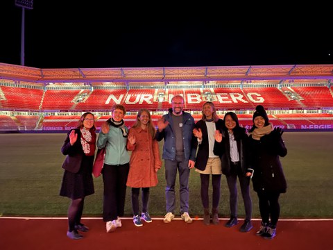 Photo of the team taken at the football stadium in Nuremberg during NaMa conference