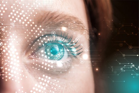 Left: Detail of a woman's face: eye, bridge of nose, eyebrow and hair. A technical-looking graphic is superimposed.