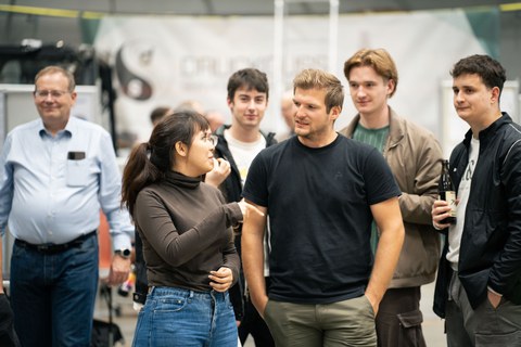 Students and staff in dialogue.