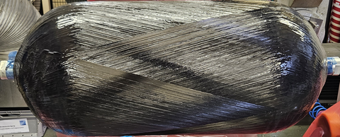 An ILK wet-wound pressure tank with an improved layer structure to increase the gravimetric and volumetric storage density.