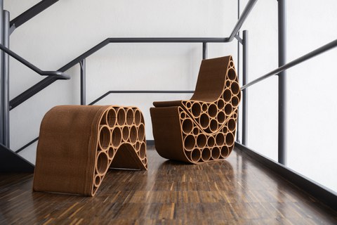 3D-printed seating group made from biodegradable and recyclable material. Three identical elements that can be flexibly positioned and stacked to create different seating arrangements.