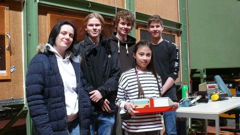 Student group with ship model