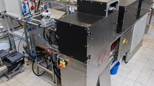 Pictur of a test rig with cables, tubes and three boxes with metal housings.