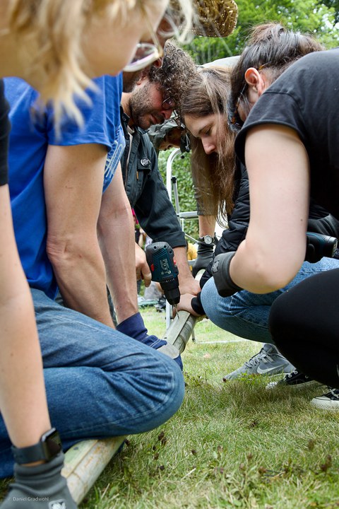 Students constructing the bamboo sculpture