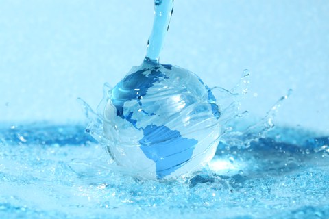 The earth, made of glass which is covered by water.