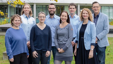All members of the RecTech team in group photo in front of the building where they do their research