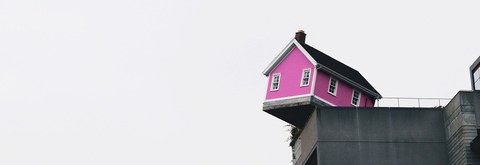 Picture showing wooden house on top of skyscraper