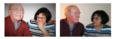 An older couple (a man and a woman) are laughing 
