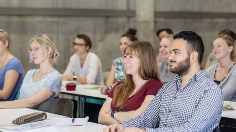 Photo of several people sitting a seminar room