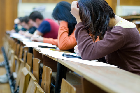 Students taking notes in lecture