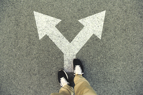 Arrow divided into two parts with a pair of feet on the end of the arrow