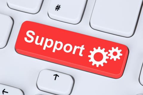 Cutout of a keyboard with the word "Support" on a red key