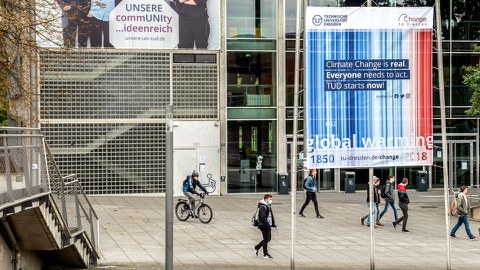 Photo of a climate change banner in front of TUD's Auditorium Center