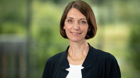 Woman in front of blurred background