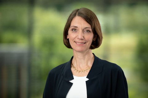 Woman in front of blurred background