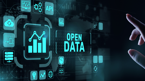 Visualisierung eines Touch-Bildschirms, auf dem unterschiedliche Symbole in Kacheln abgebildet sind. In deren Mitte befindet sich ein Diagramm. Rechts davon ist der Schriftzug "Open Data" zu erkennen.