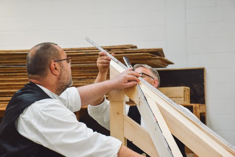 Carpenters working with wood.