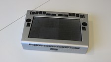 Photo shows the Hyperbraille - a tactile display lying on the table