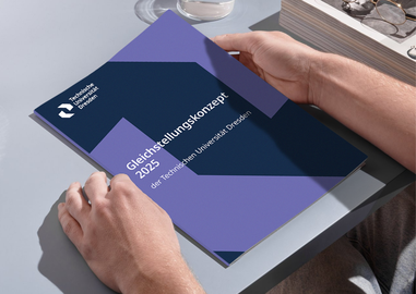 Two hands hold a booklet. The booklet is titled “2025 Equality Concept of TUD.”