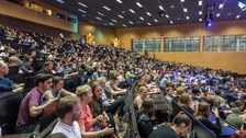 A large number of people in a lecture hall