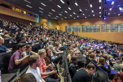 A large number of people in a lecture hall
