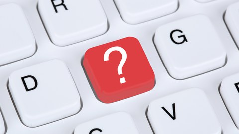 Foto einer Tastatur, bei der der Buchstabe „F“ als rote Taste mit Fragezeichen dargestellt ist