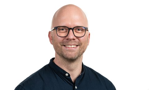 Friendly smiling man wearing glasses