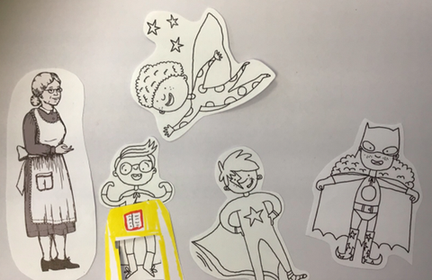 Es ist ein Bild, das mit Papierfiguren mittles Legetechnik gelegt wurde. Man sieht ein Schulkind, drei Superhelden-Kinder und eine Lehrerin bzw. ein Dienstmädchen.